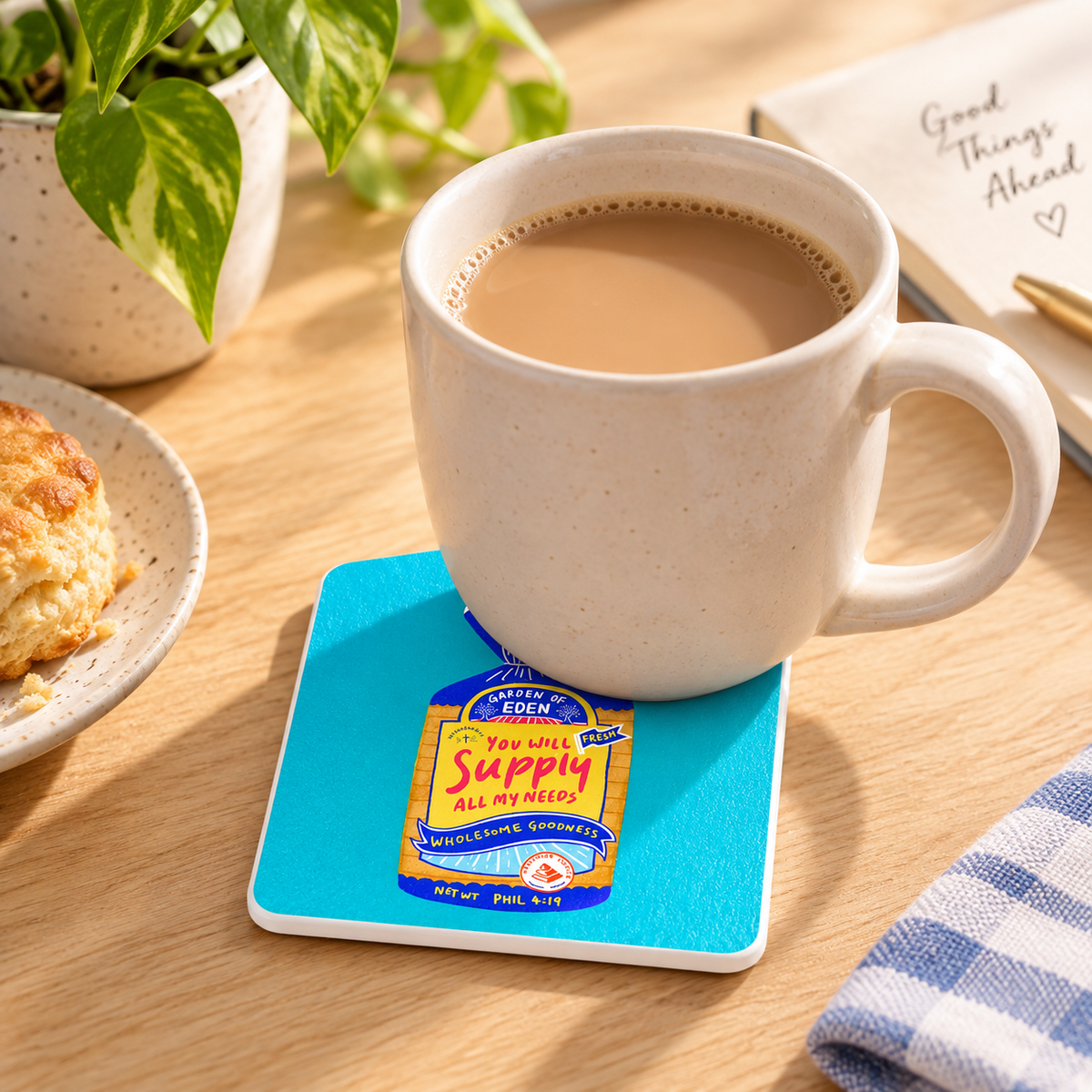 Wholesome Bread Philippians 4:19 Christian coaster with white sides styled under a ceramic coffee mug in warm natural light