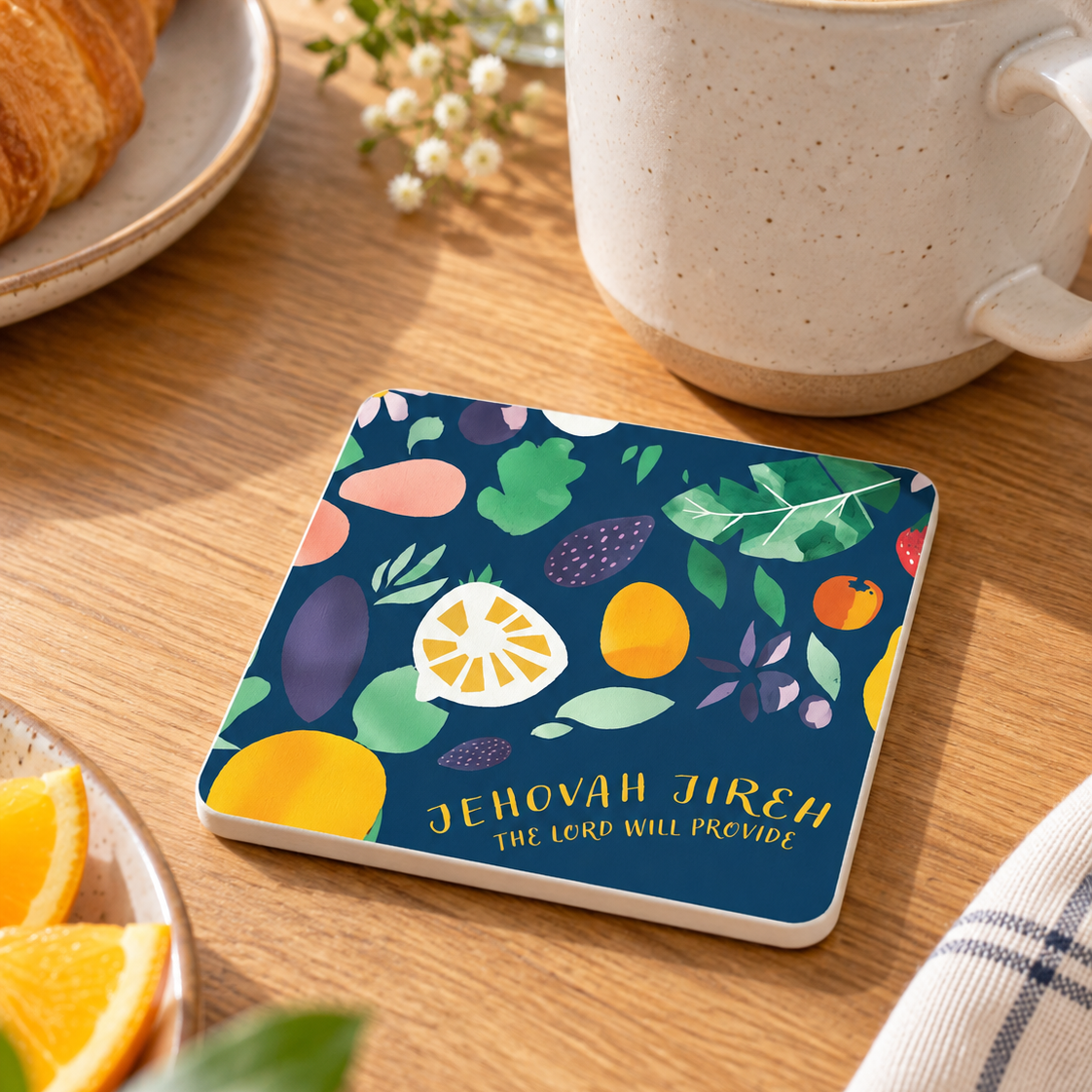 Jehovah Jireh Christian coaster with white sides styled beside coffee and breakfast in warm natural light