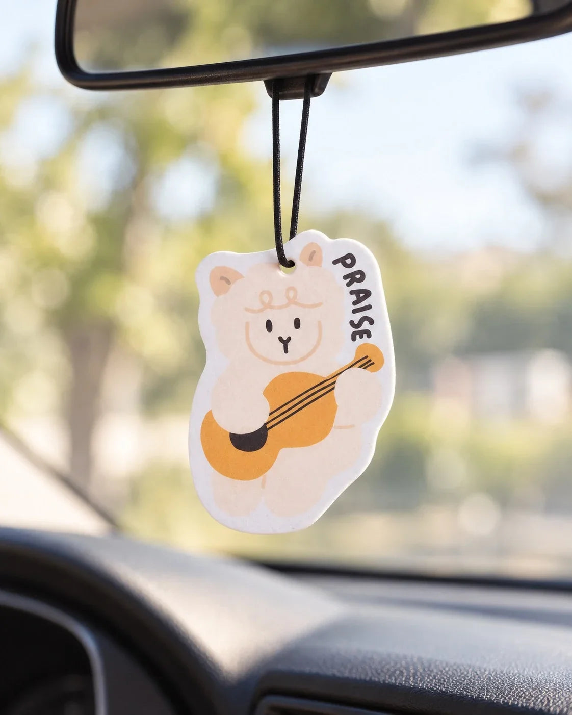 Praise the Lamb sheep scent tag hanging in car