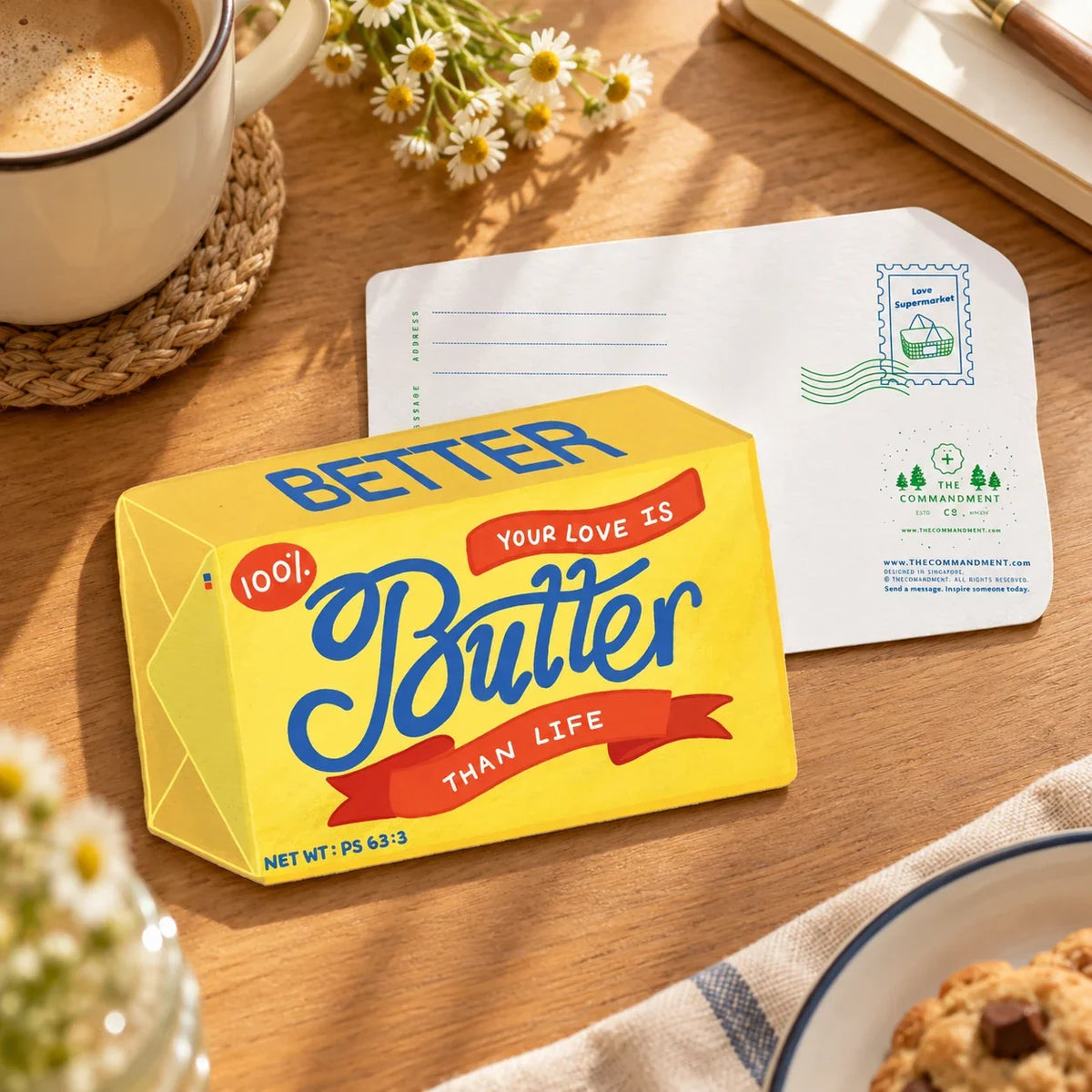Butter Than Life greeting card and envelope on a wooden table