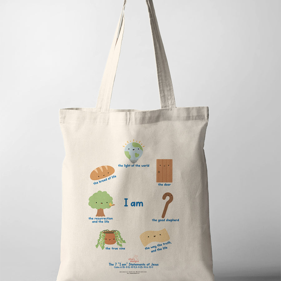 Christian canvas tote bag featuring the 7 “I Am” statements of Jesus with cute illustrated icons including the bread of life, light of the world, good shepherd, and true vine, collaboration with Chari Designs.