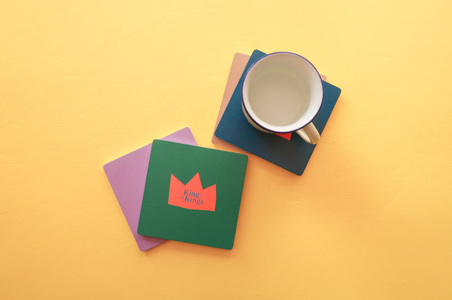 Christianity Coaster Pack: Colorful wooden square coasters with geometric designs.