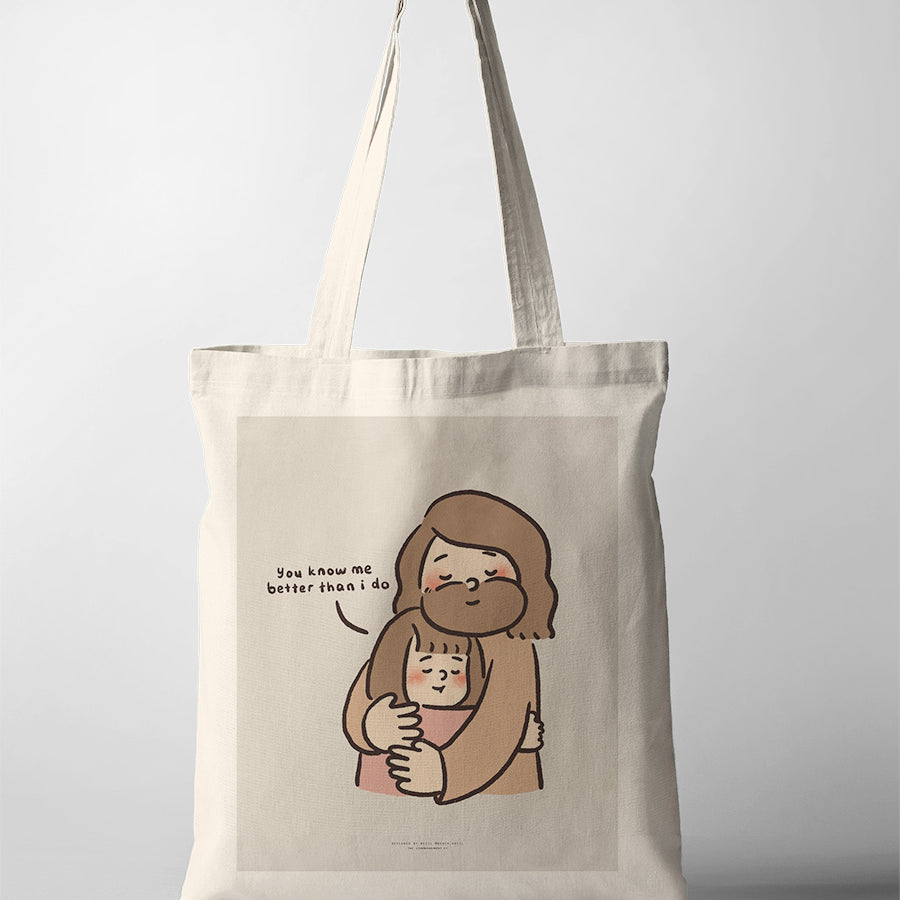 Canvas tote bag featuring a comforting illustration of Jesus hugging a child, with the words 'You know me better than I do,' symbolizing love and understanding.