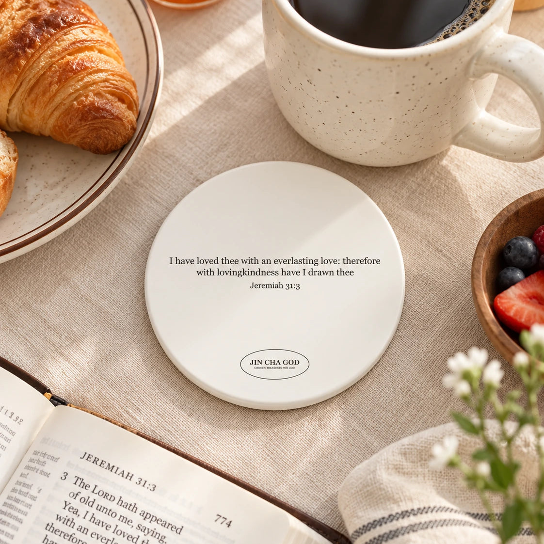 I Have Loved Thee With ceramic coaster featuring Jeremiah 31:3 in a cosy breakfast scene.