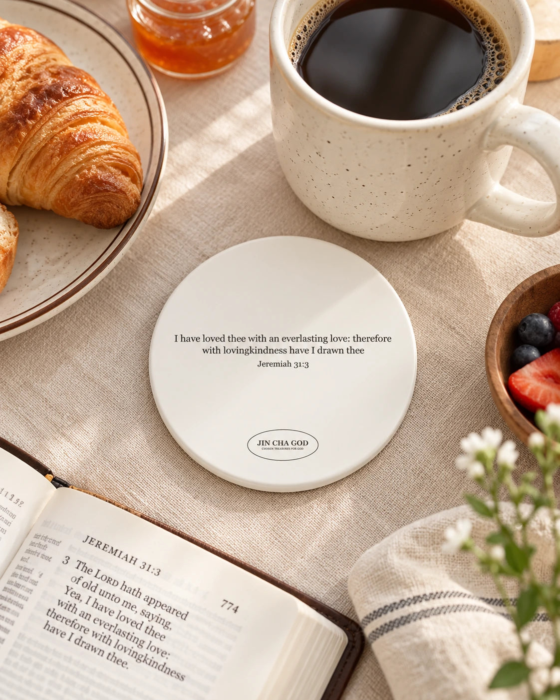 I Have Loved Thee With ceramic coaster featuring Jeremiah 31:3 in a cosy breakfast scene.