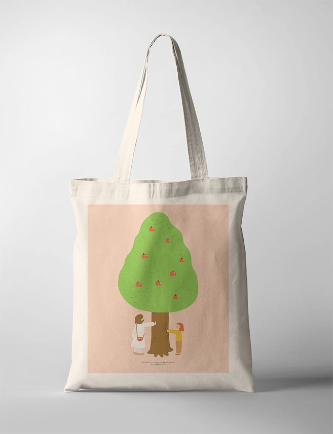 Faith based tote bag featuring a charming illustration of a green tree with Jesus and a girl underneath, set against a soft pink background.