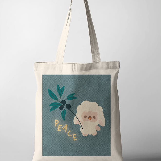Canvas tote bag featuring a faith based poster design with a sheep and a teal vine against a muted blue background, conveying spiritual serenity and grace.