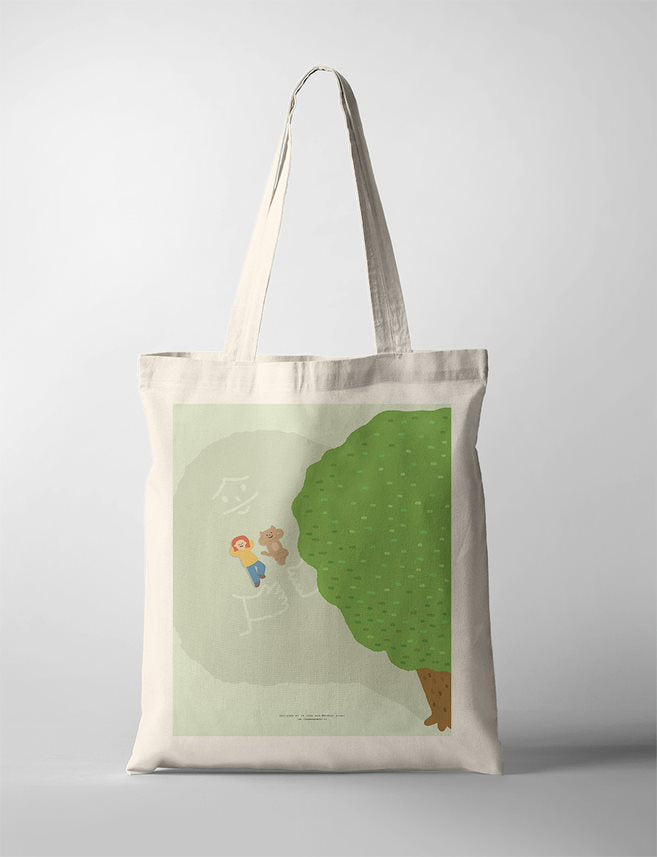 Faith based Tote Bag featuring a serene scene with a small group of people gathered under a large, lush green tree. The soft background provides a tranquil, spiritual setting that evokes a feeling of community and faith