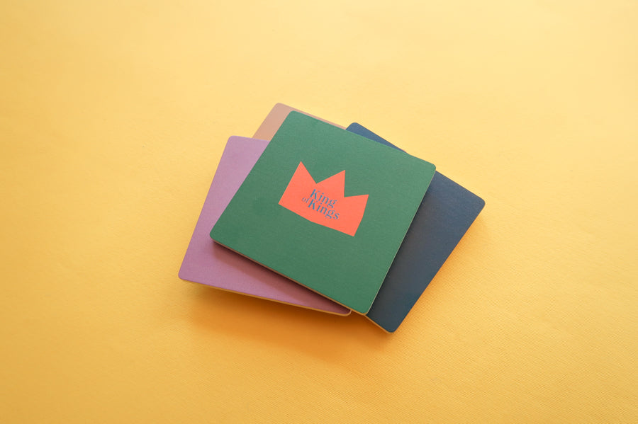 Colorful Faith Coaster Collection: Geometric wooden square coasters with Christian designs.