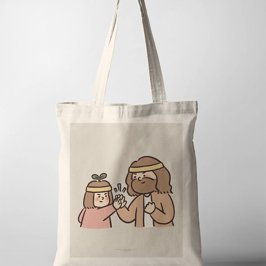 Canvas tote bag featuring an encouraging illustration of Jesus and a child in matching headbands, sharing a joyful high-five, symbolizing teamwork and support.
