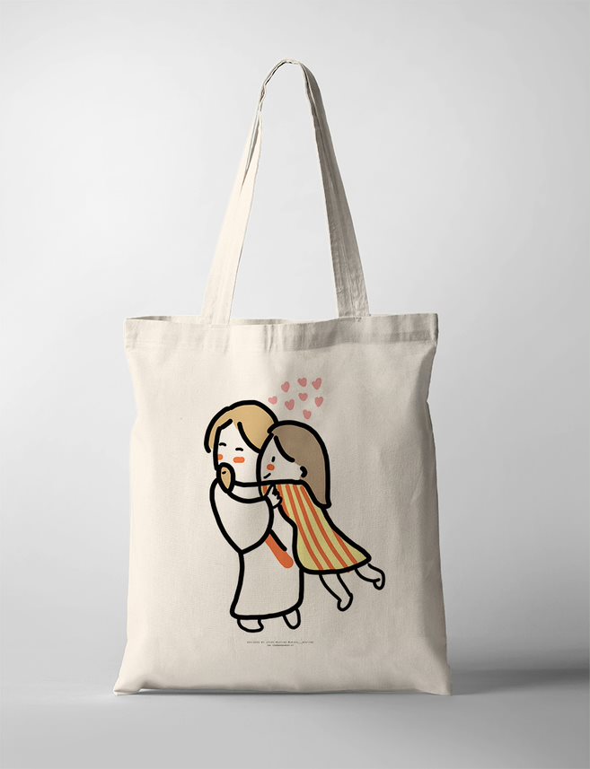 A touching Christian Tote Bag of Jesus embracing a child in a warm and loving hug, with floating hearts above them symbolizing divine love. This faith-filled artwork radiates comfort, security, and the unconditional love of Christ, making it an ideal faith-based inspirational wall decor piece for any space.