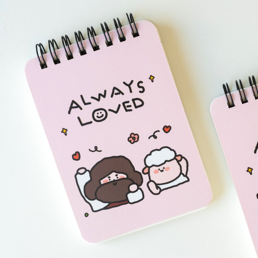 Pink "Always Loved" notepad featuring cute illustrations of Jesus and a sheep, spreading encouragement and simple happiness with every note.