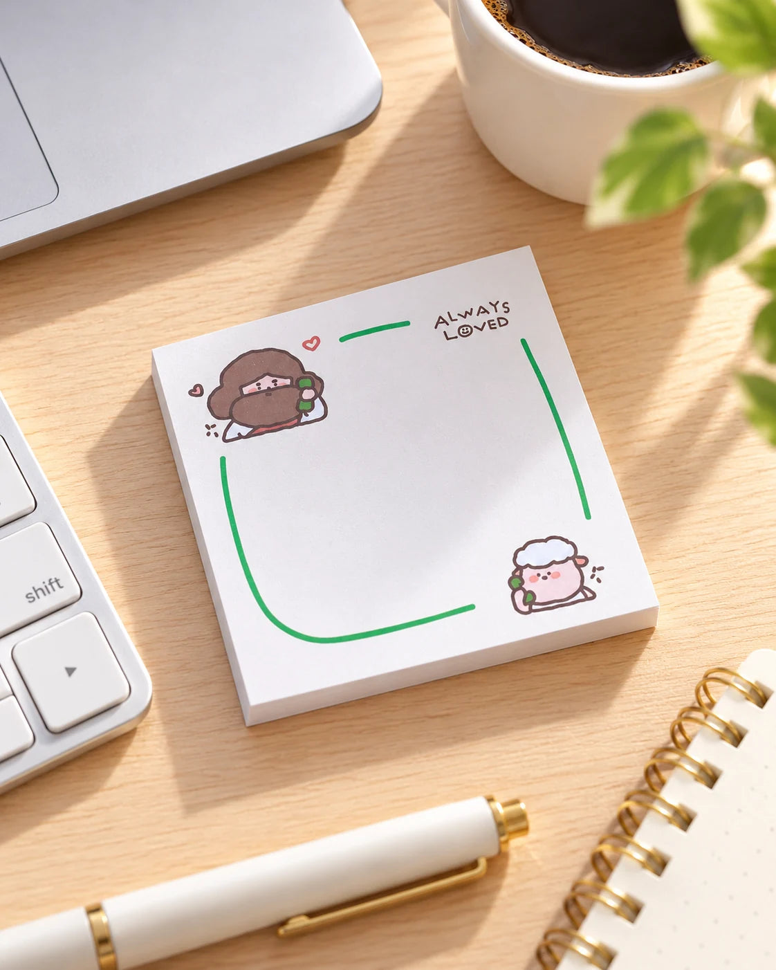 Always Loved Christian sticky notes on a sunny desk beside a laptop and pen.