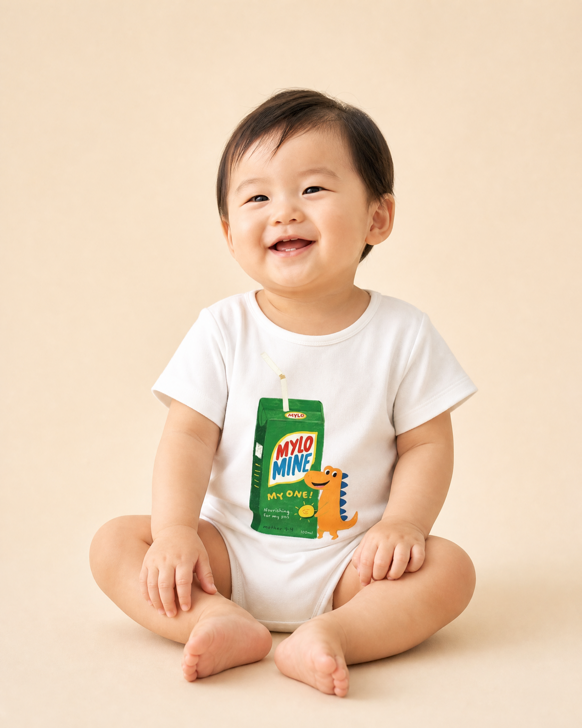 Baby wearing the Mylo Mine dinosaur drink packet Christian romper