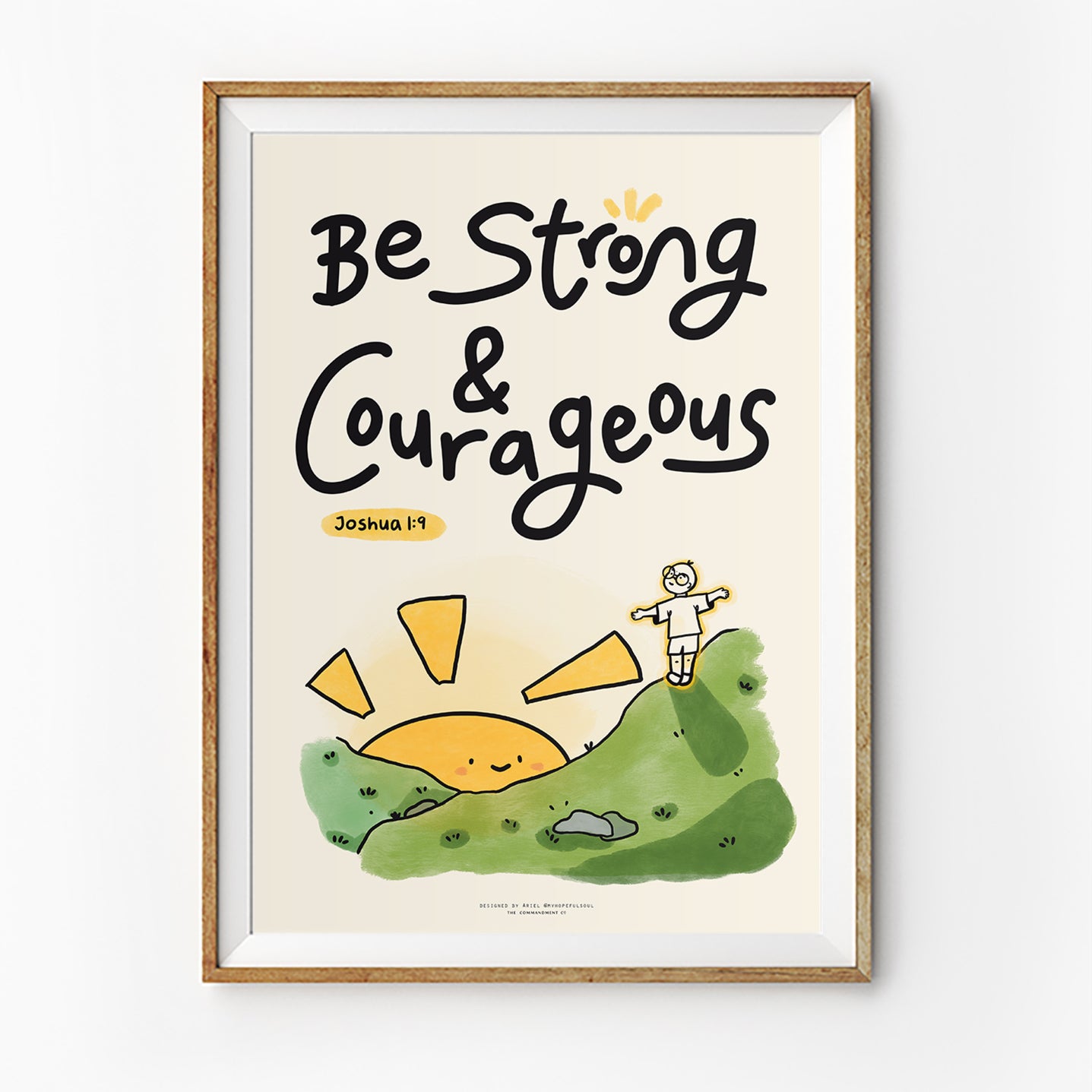 Christian wall art poster featuring the phrase “Be Strong & Courageous” from Joshua 1:9 with cute illustrated hill and sunrise, in collaboration with @myhopefulsoul.