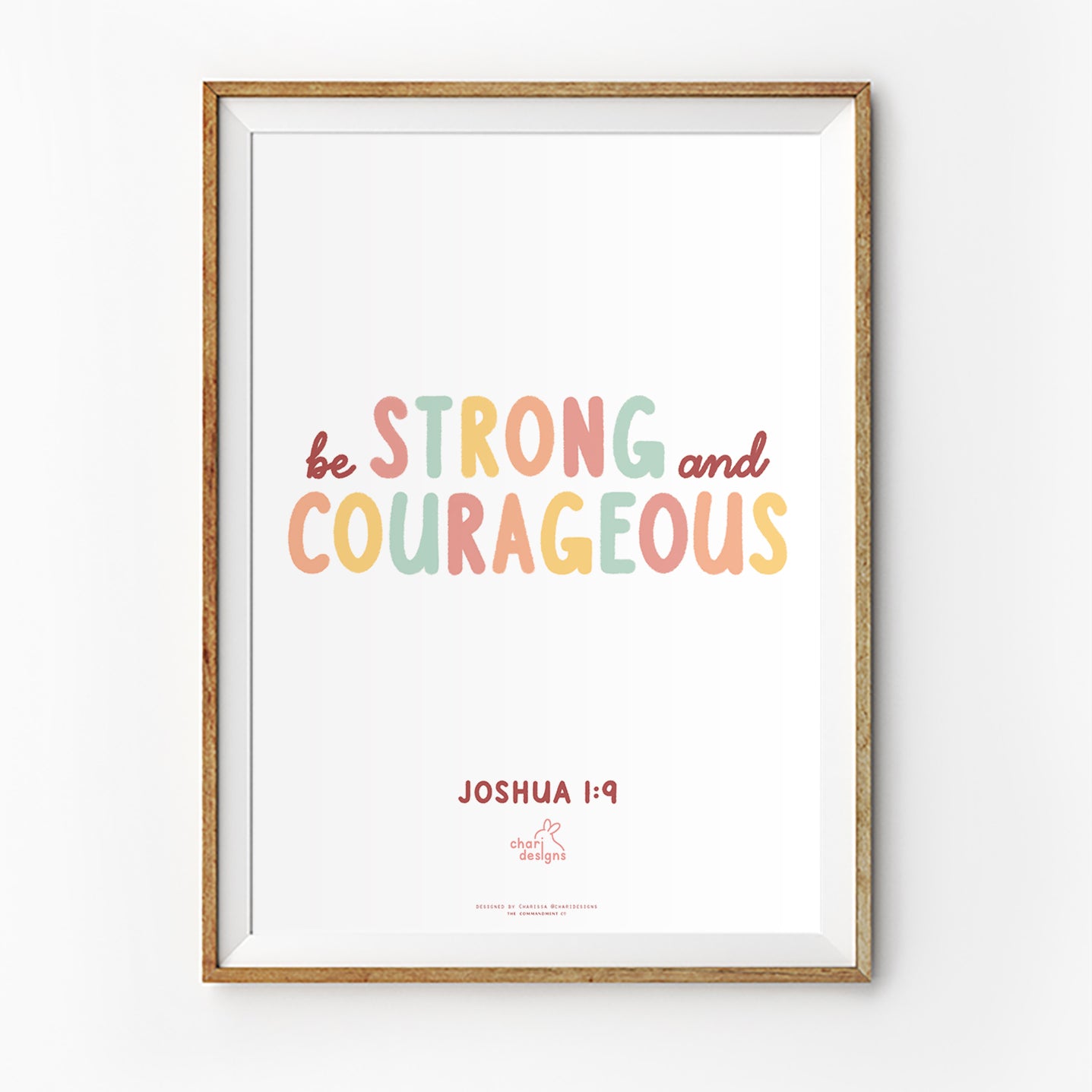 Christian wall art print featuring “Be Strong and Courageous” from Joshua 1:9 in pastel typography, collaboration with Charidesigns.