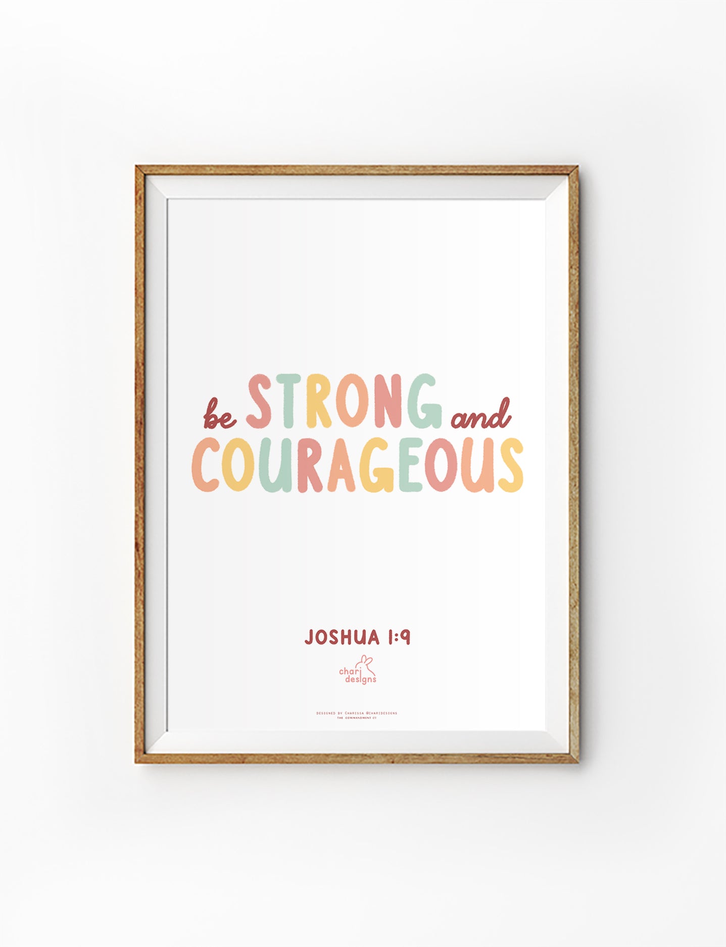 Christian wall art print featuring “Be Strong and Courageous” from Joshua 1:9 in pastel typography, collaboration with Charidesigns.