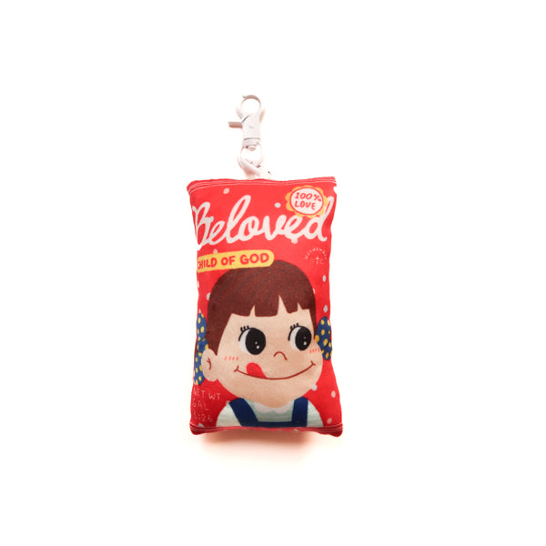 Beloved Milk Candy Girl plushie keychain with red candy packet design and Child of God detail