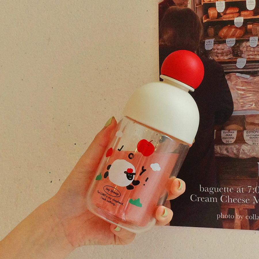 Cheerful glass bottle with sheep design and Christian message