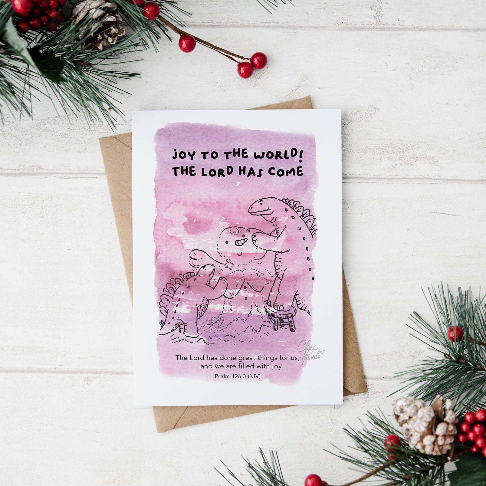 ChezHemdi A6 dino postcard with ‘Joy to the World, The Lord Has Come’ verse – Christian Christmas card from The Commandment Co