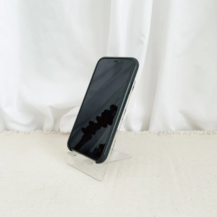 Faith-based phone stand with a phone displayed on the stand.