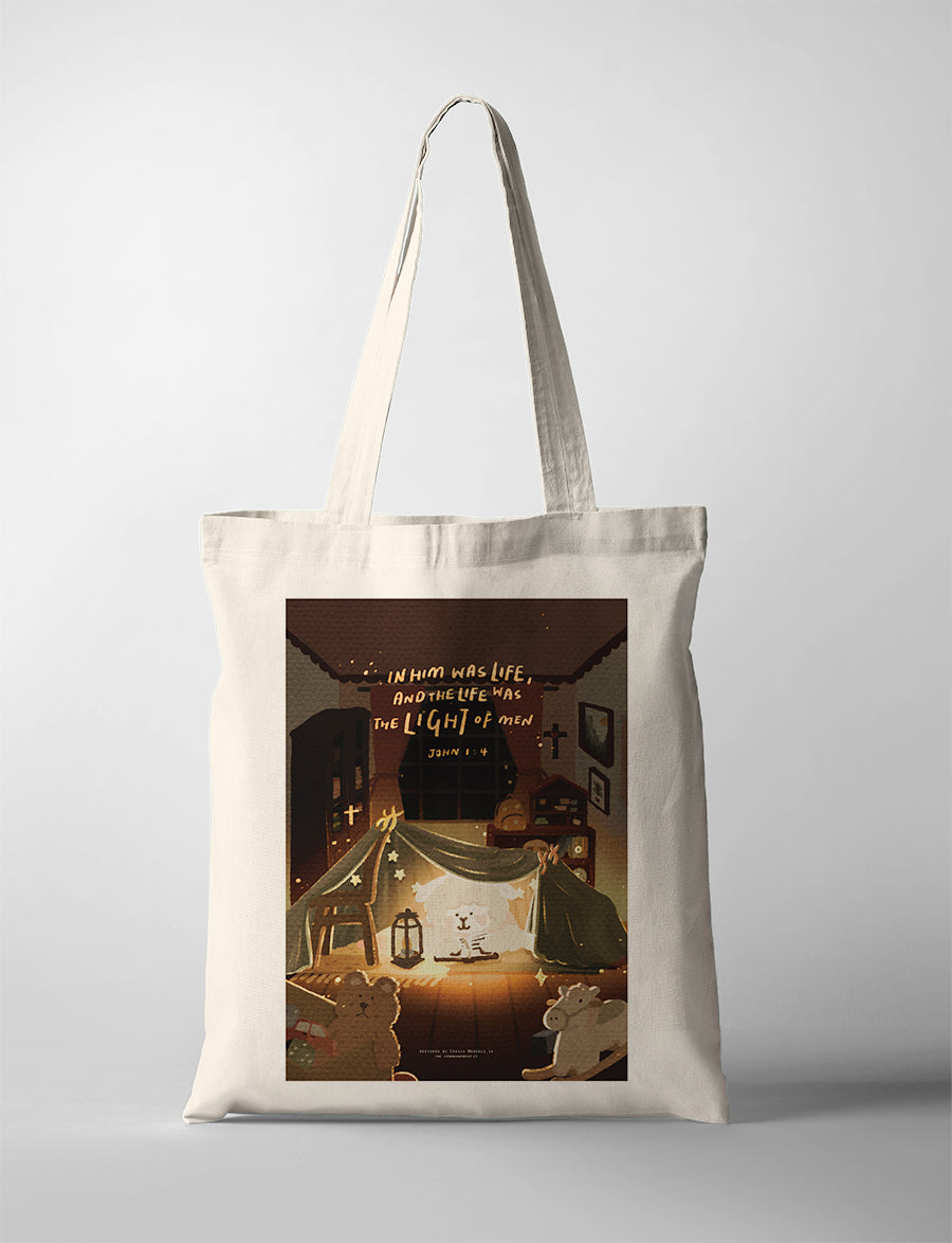 Natural canvas Christian tote bag featuring a cosy night-time blanket fort illustration and John 1:4 about the light of men.