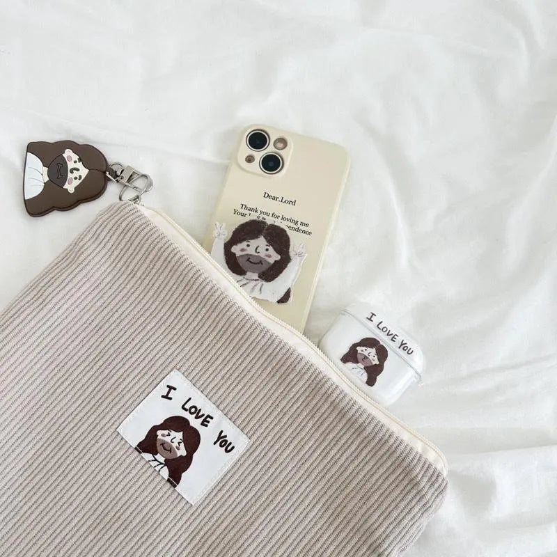 YA! Jesus phone grip attached to a phone and styled with a Christian pouch, keychain and everyday accessories