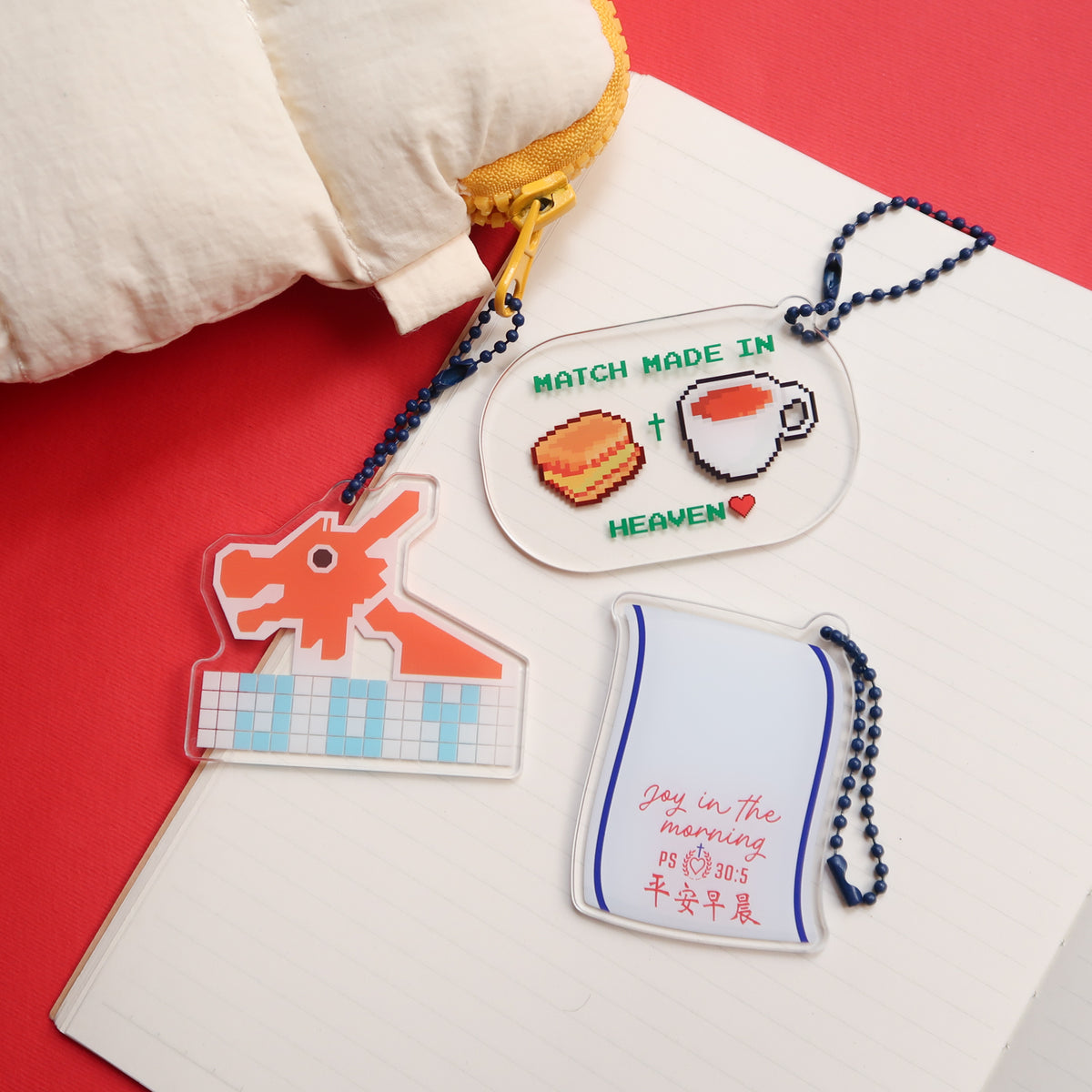 Set of three acrylic keychains with Christian themes, including "Joy in the morning" Psalm 30:5, "Match Made in Heaven," and a dragon design, from The Commandment Co, Singapore.