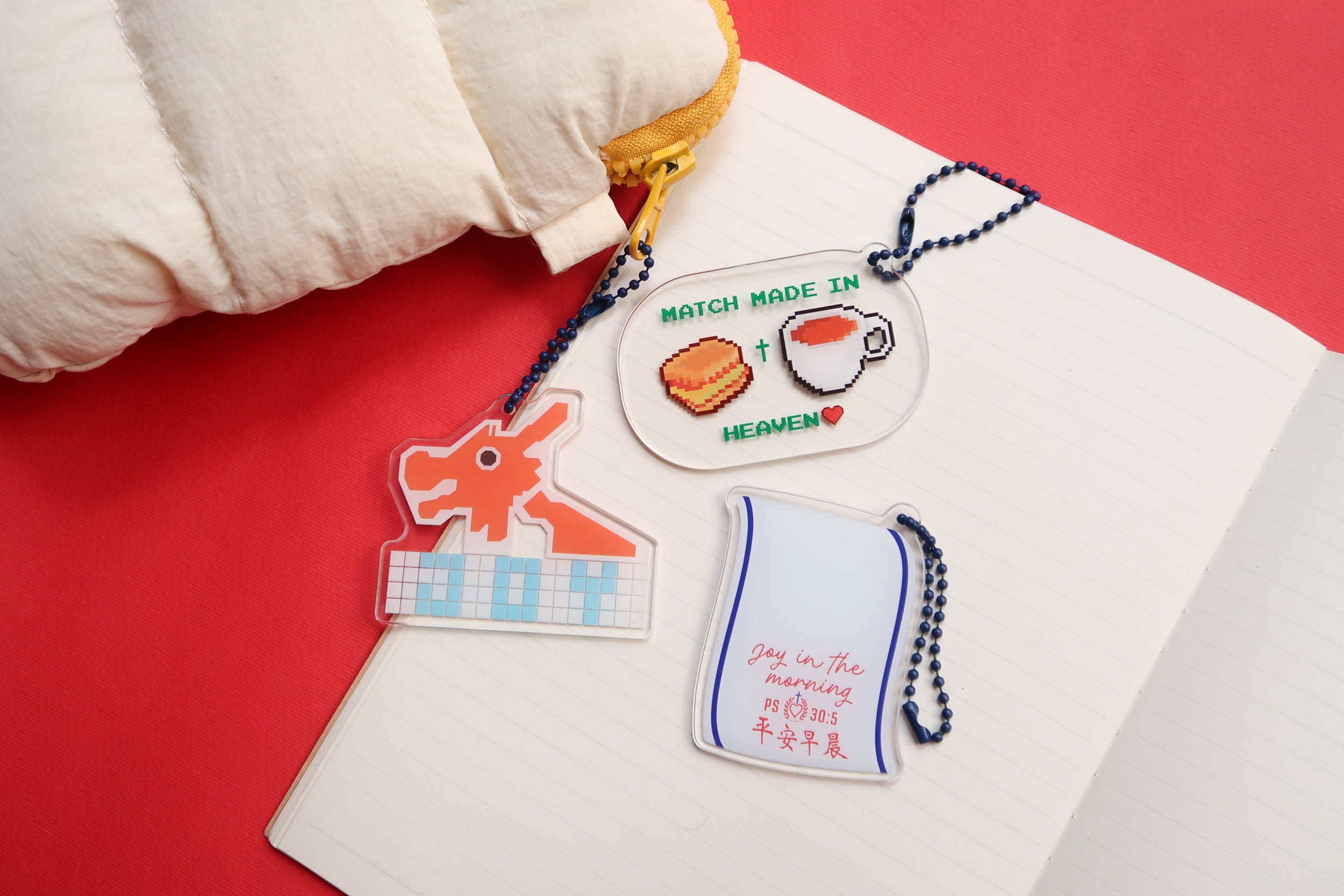 Set of three acrylic keychains with Christian themes, including "Joy in the morning" Psalm 30:5, "Match Made in Heaven," and a dragon design, from The Commandment Co, Singapore.