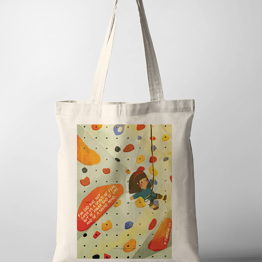 Christian tote bag featuring a cheerful girl rock climbing on a colorful wall, with the encouraging Bible verse "For God has not given us a spirit of fear, but of power and of love and of a sound mind" from 2 Timothy 1:7, inspiring courage and simple happiness.