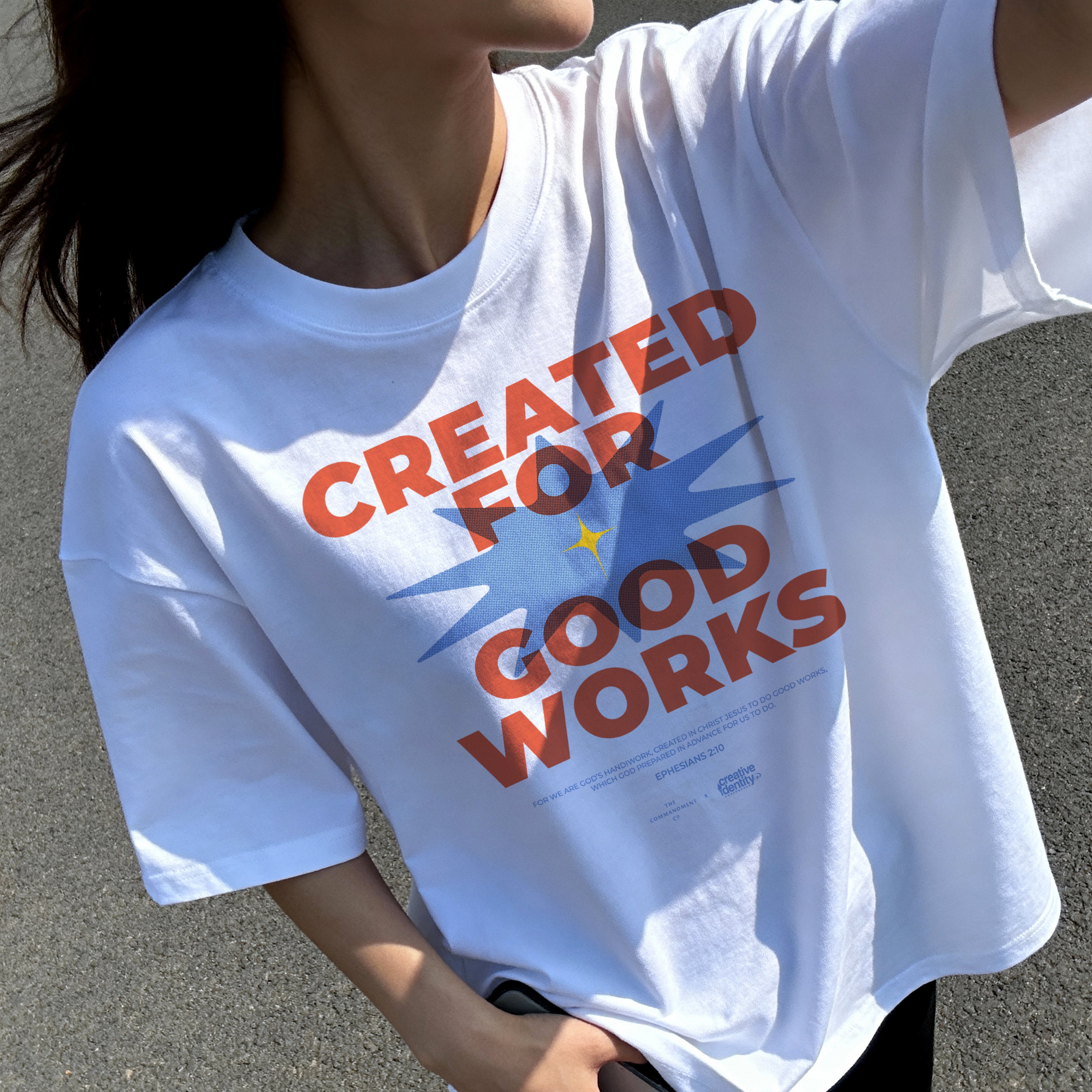 Lifestyle shot of a white oversized “Created for Good Works” Christian t-shirt worn outdoors, featuring a bold faith-based design inspired by Ephesians 2:10.