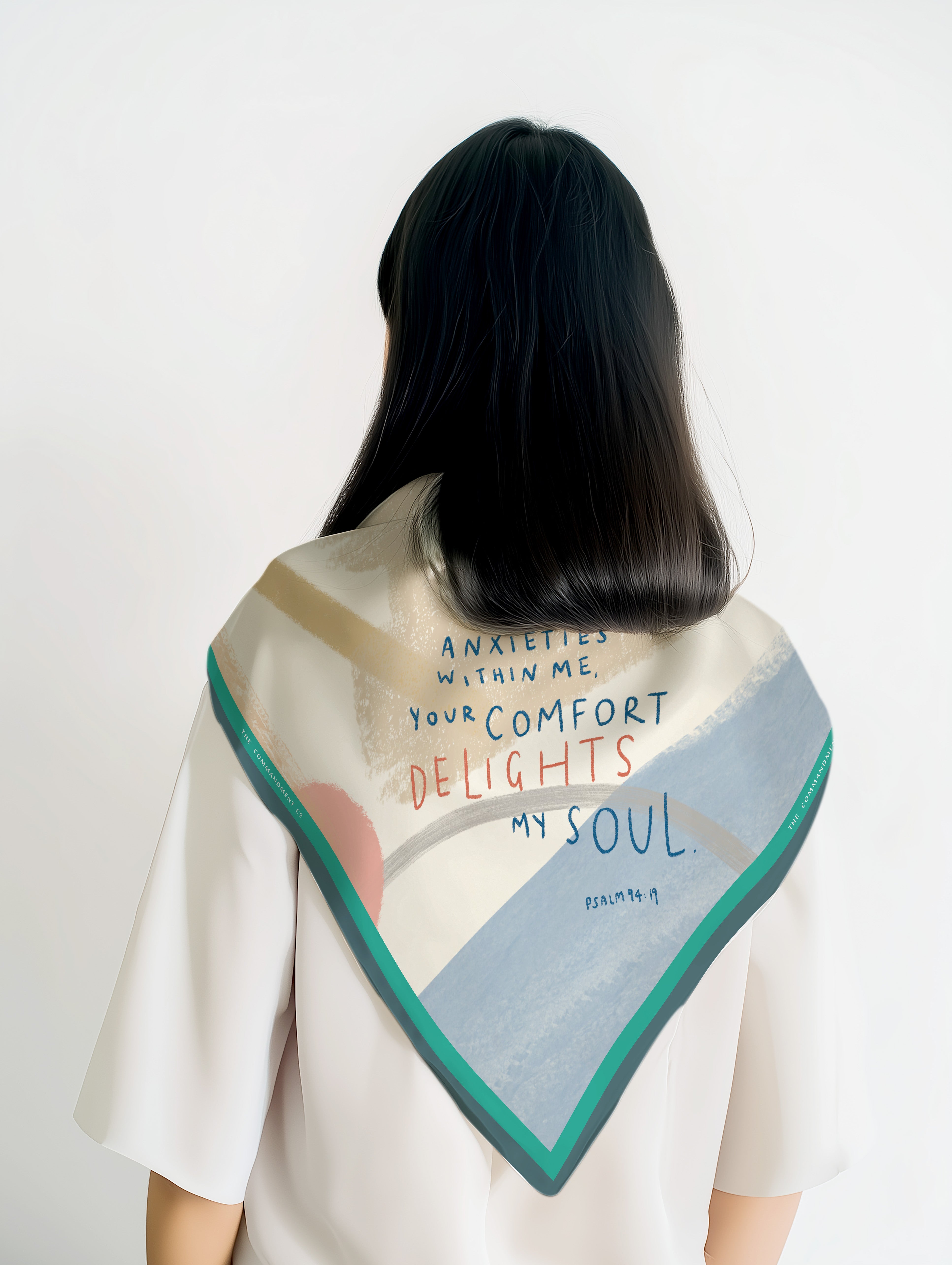 Delights My Soul scarf worn by a model, featuring Psalm 94:19 verse on a pastel abstract background with a teal border.