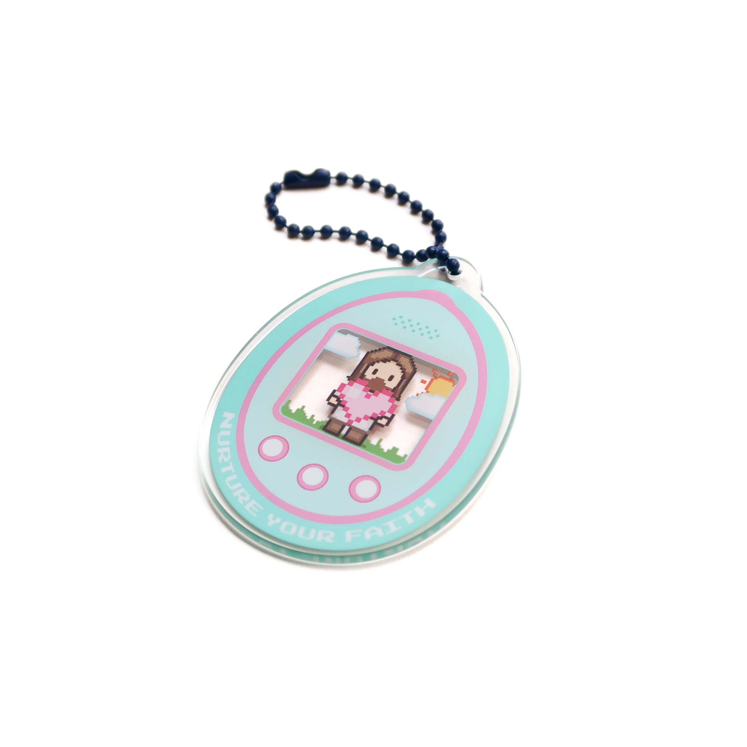 Round teal digital-pet acrylic keychain featuring pixel-art character, edge text "NURTURE YOUR FAITH," attached to a blue ball chain