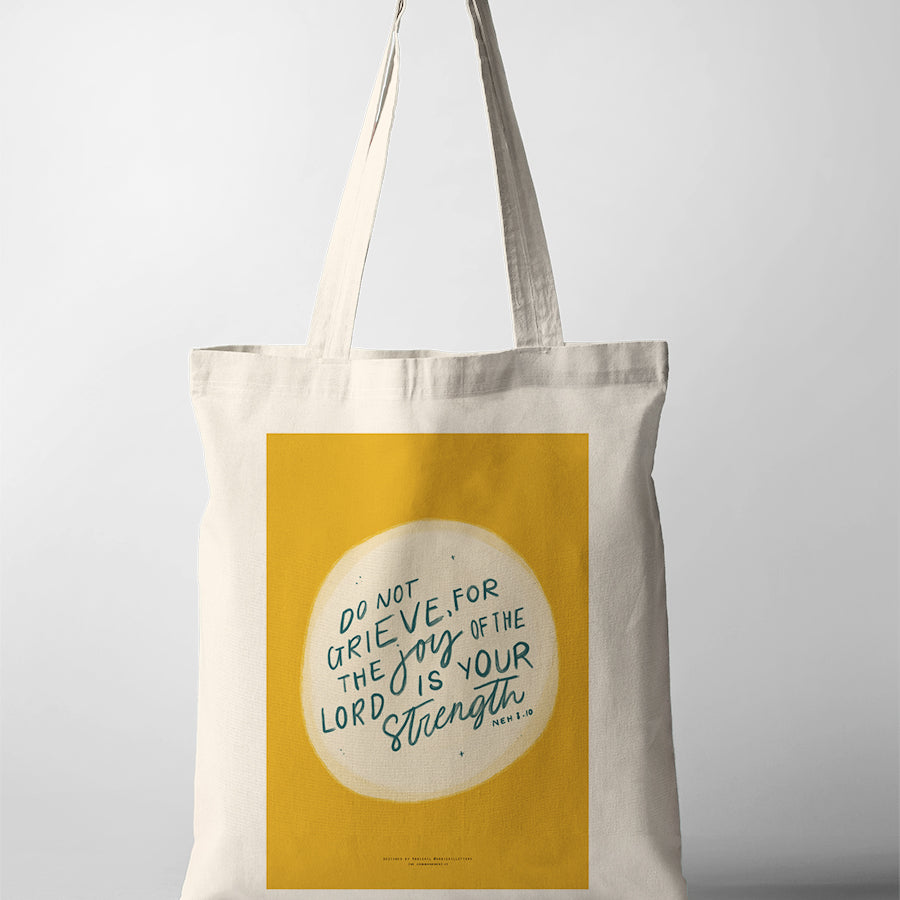 Christian tote bag featuring Nehemiah 8:10, “Do not grieve, for the joy of the Lord is your strength”