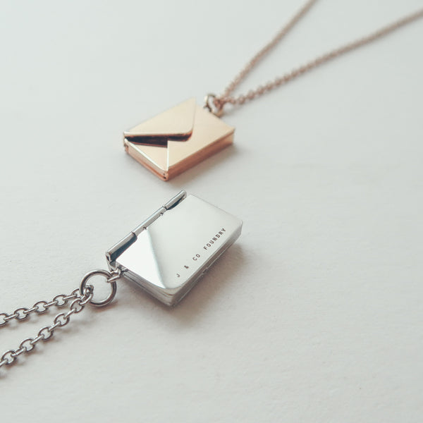 Envelope Locket personalised necklace by J&Co Foundry in a styled product view.