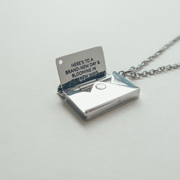 Envelope Locket necklace in a close-up jewellery view.