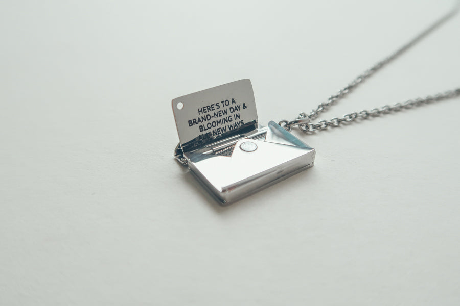 Envelope Locket necklace in a close-up jewellery view.