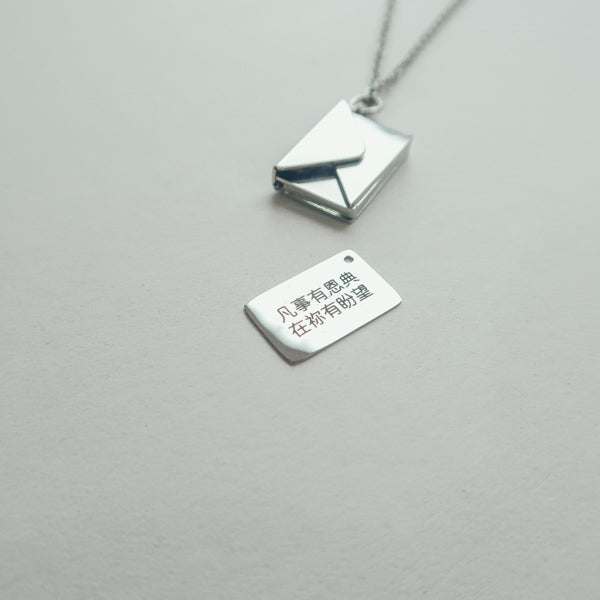 Personalised Envelope Locket necklace styled as a meaningful gift.