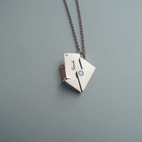 Envelope Locket necklace detail showing its personalised metal insert.