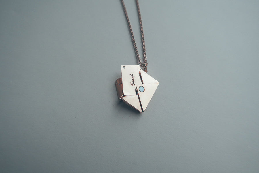 Envelope Locket necklace detail showing its personalised metal insert.