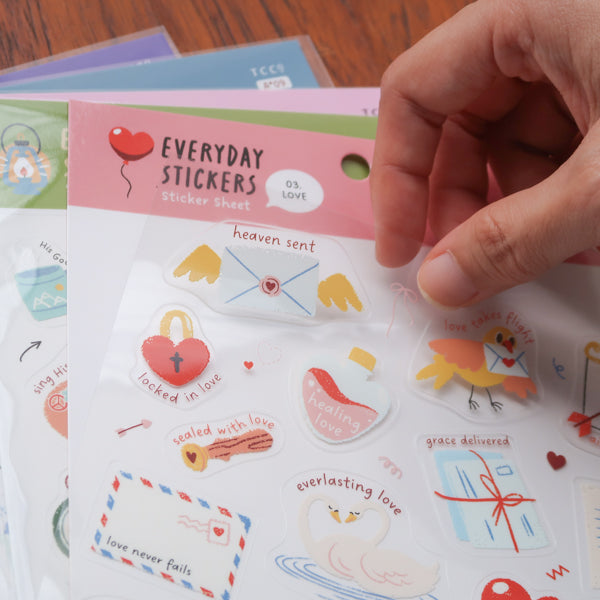 Close-up of everyday believer love themed Christian sticker sheet featuring cute illustrations like hearts, envelopes, dove, and faith-inspired phrases about love