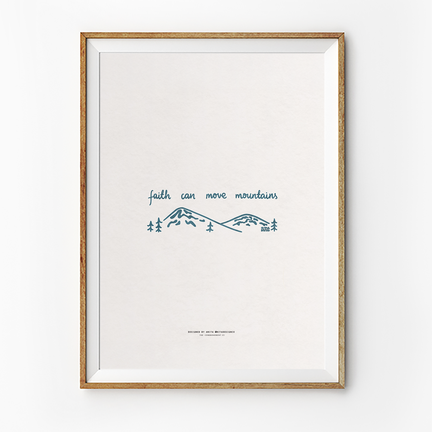 Minimalist "faith can move mountains" poster in a wooden frame, featuring simple blue line art of mountains and trees, inspiring Christian faith and simple happiness.