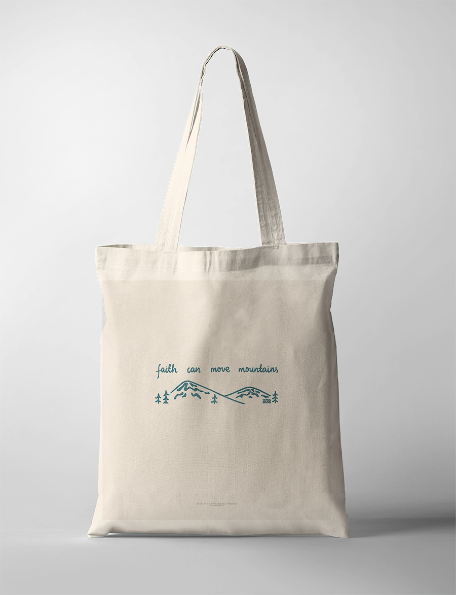 Minimalist "faith can move mountains" tote bag, featuring simple blue line art of mountains and trees, inspiring Christian faith and simple happiness.