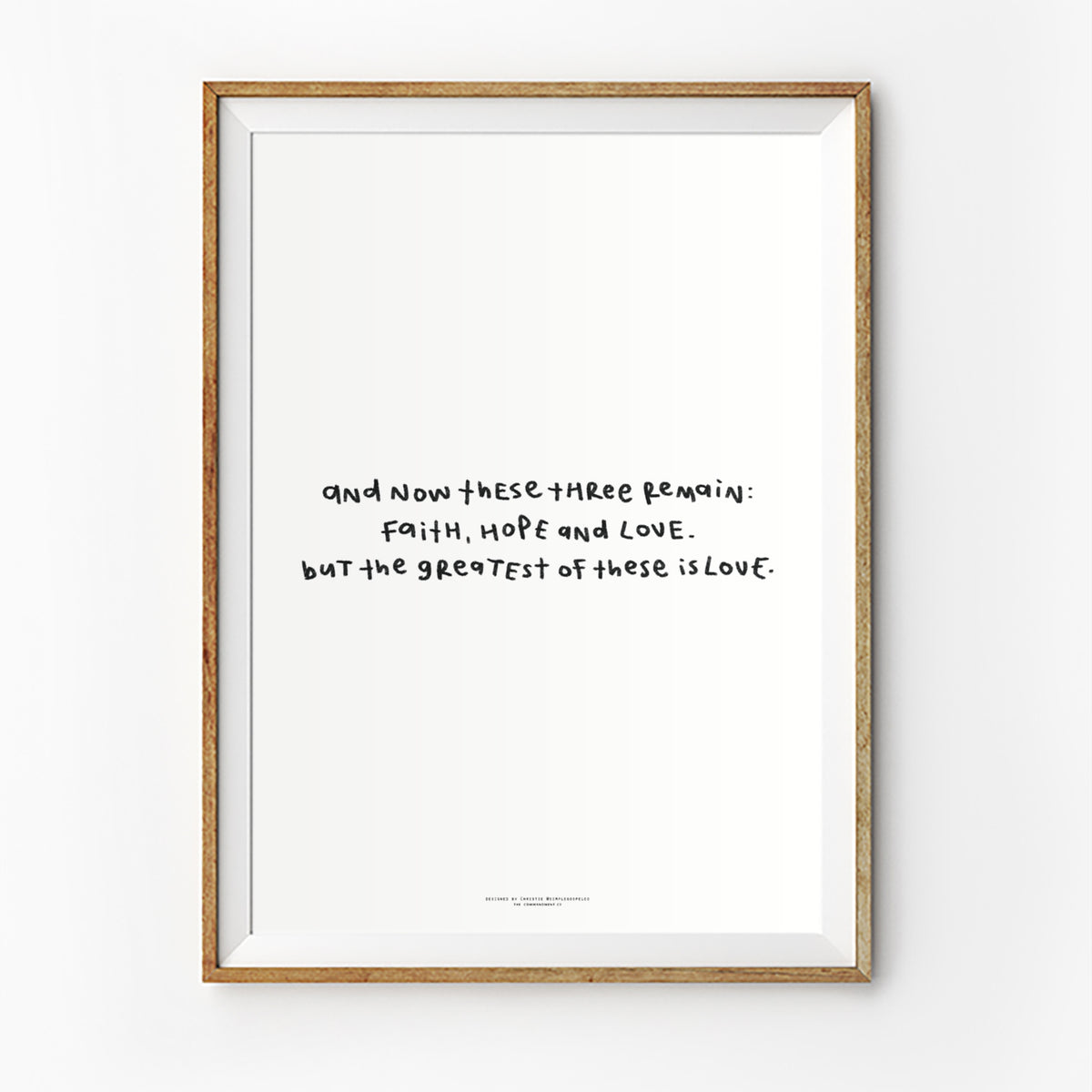 Faith Hope Love Bible verse poster featuring 1 Corinthians 13:13 in a simple handwritten style, displayed in a framed wall art mockup.
