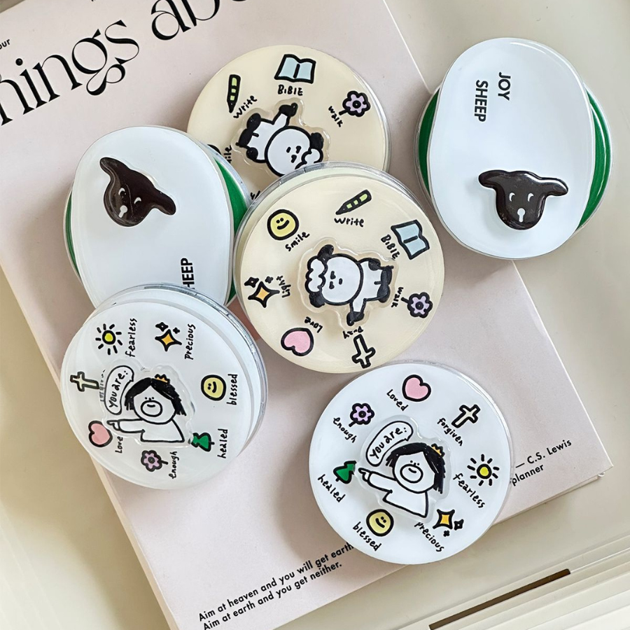 Faith-inspired phone spinner with motivational words and symbols.