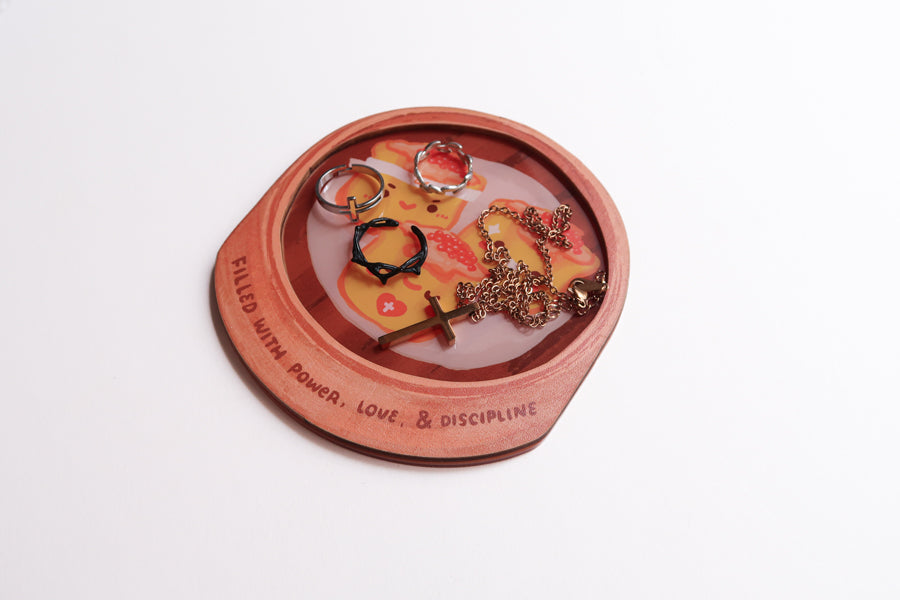 Filled with Power, Love & Discipline Christian siu mai coaster styled with cross necklace and rings.
