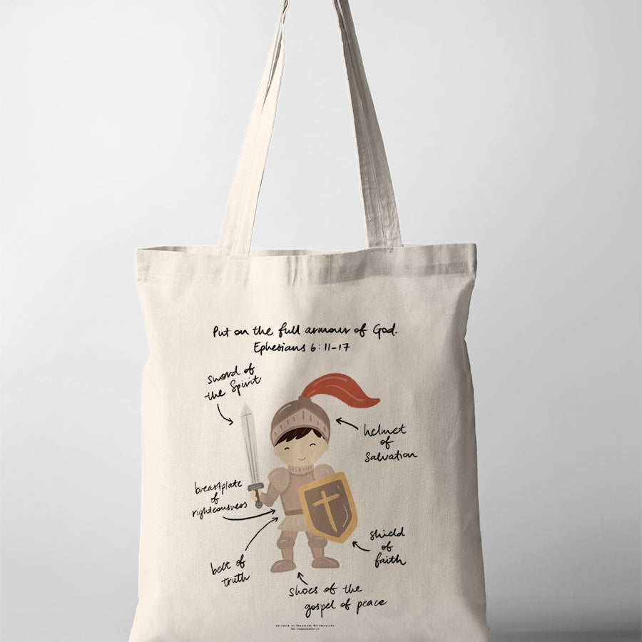 Christian kids tote bag featuring a boy in the full armour of God with labelled pieces from Ephesians 6:11–17, including the sword of the Spirit, helmet of salvation, shield of faith, belt of truth, breastplate of righteousness, and shoes of the gospel of peace.