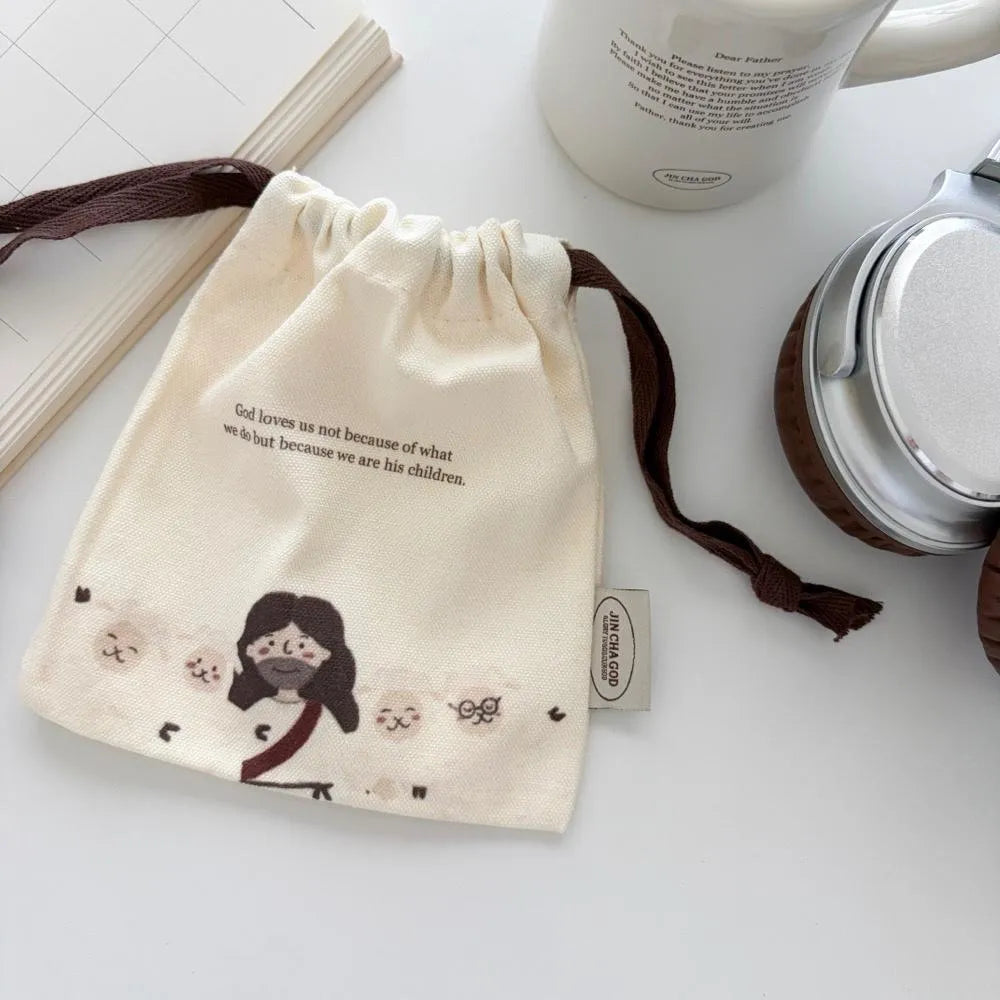 Cream Christian drawstring pouch featuring the message “God loves us not because of what we do but because we are His children”