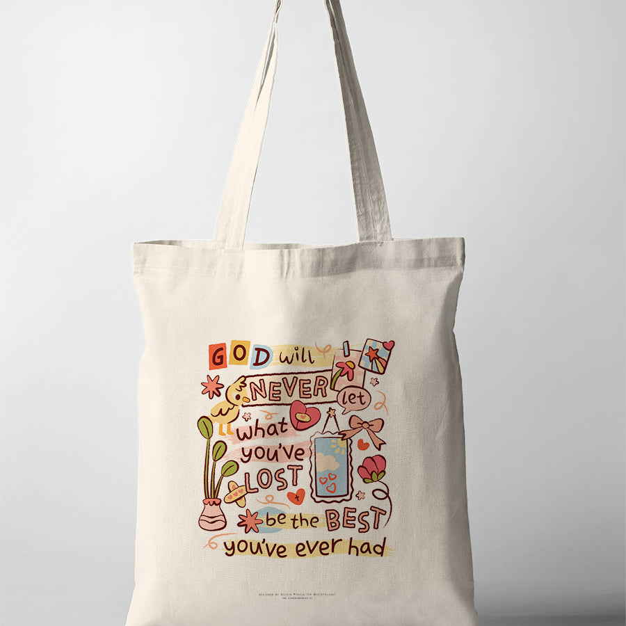 Christian tote bag featuring “God will never let what you’ve lost be the best you’ve ever had” with playful hand-lettered artwork