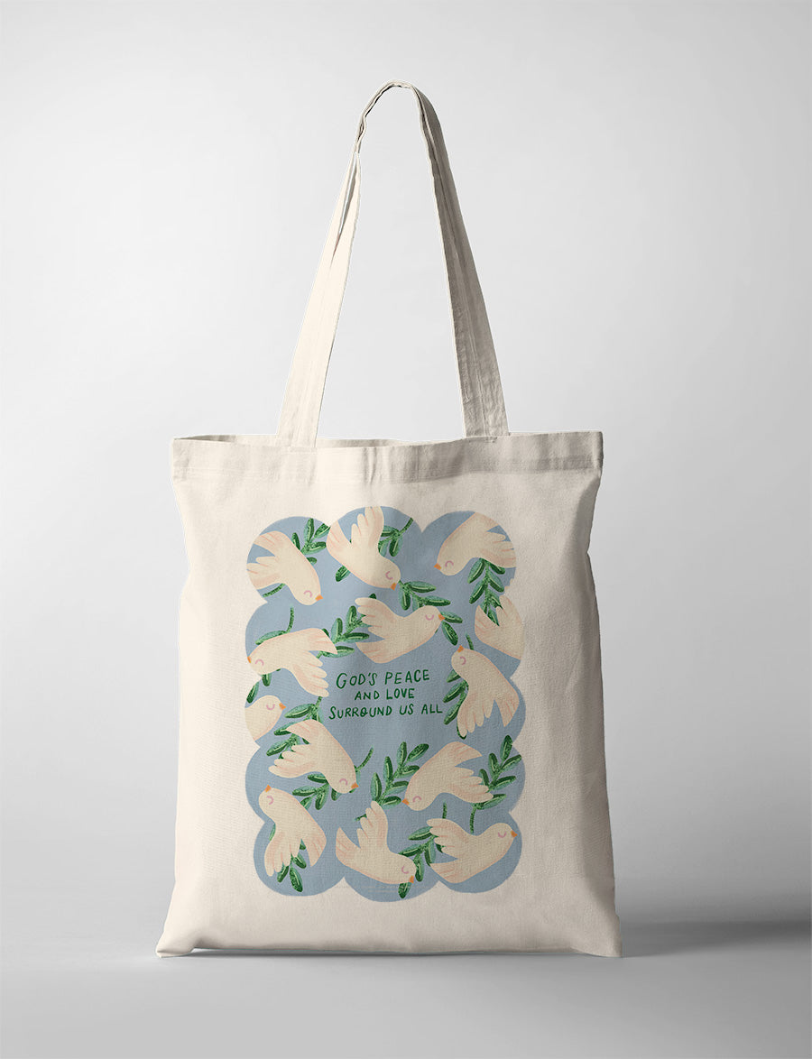 A canvas tote bag with a nature-inspired design featuring a intricate pattern of green leaves and doves, creating an artistic look. This design echoes the themes often found in faith-based posters, reflecting harmony and peace